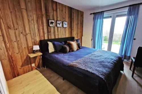 Ένα ή περισσότερα κρεβάτια σε δωμάτιο στο Het Kastanjehuis
