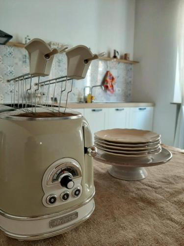 a toaster sitting on a counter in a kitchen at La Casetta Ferrara B&B in Ferrara