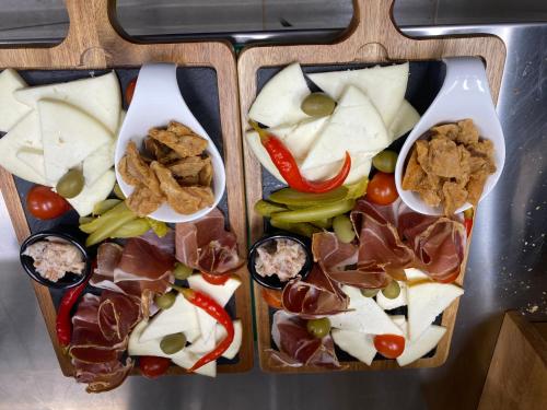 a tray with different types of food on it at Pansion Danica in Rastovača