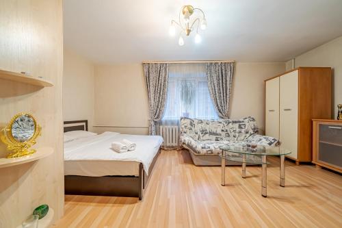 Кровать или кровати в номере Apartment by metro Frunzenskaya