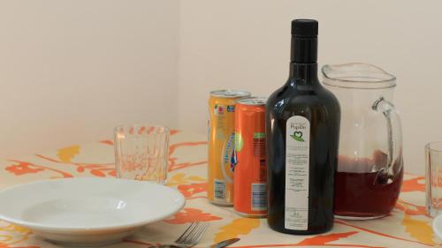 a bottle of wine sitting on top of a table at Villaggio Elisena in Vieste