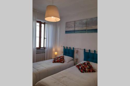 A bed or beds in a room at Casa Dori