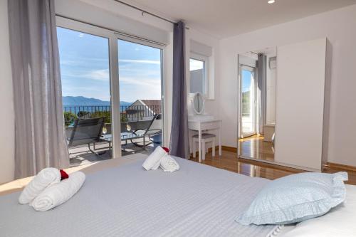 Postel nebo postele na pokoji v ubytování Apartments Latkovic