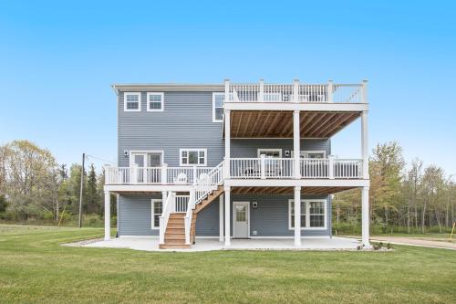 a large house with a staircase on the side of it at Practically Perfect in South Haven