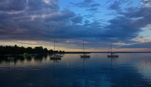 a group of boats sitting on a large body of water at Villa Aquamarine in Balatonboglár