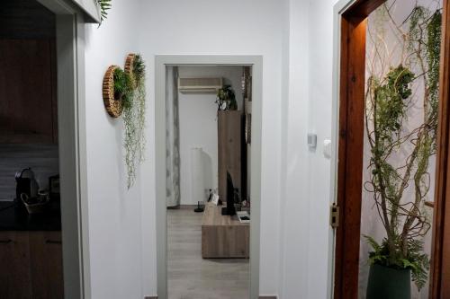 a hallway with a white wall and a door at Casa Vera in Roquetas