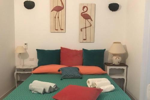 Voodi või voodid majutusasutuse Luxury & Charme fronte mare Sardinia House 5 toas