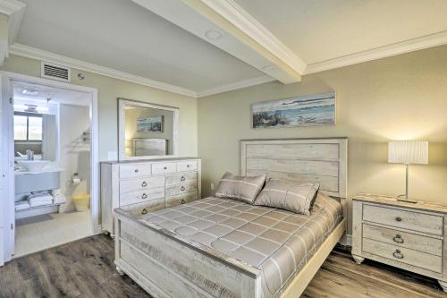 a bedroom with a large bed and a bathroom at Waterfront Resort Condo with Private Beach and Pool in Hudson