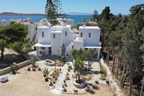 an aerial view of a white house with trees at Kiki's apartment huge balcony dream in Chrissi Akti