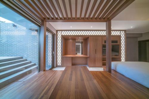 a bedroom with a bed and a staircase at Yeon Hwa Moon Hotel in Incheon