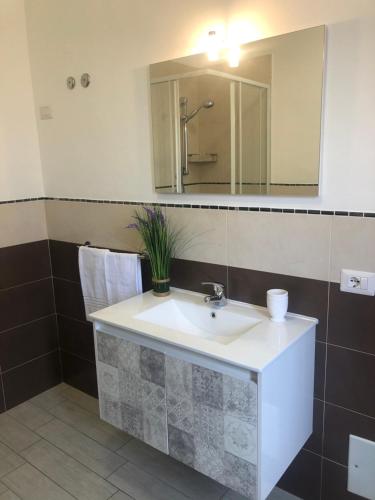 a bathroom with a sink and a mirror at B&b il Patio in Villasimius
