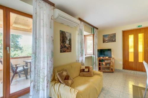a living room with a couch and a table at Apartment 4827-2 for 4 Pers in Nerezine in Nerezine