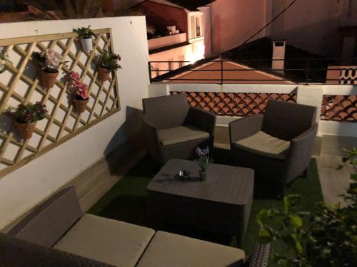 a view of a patio with chairs and a table at Home SEA&DREAMS OldTown I in Calpe