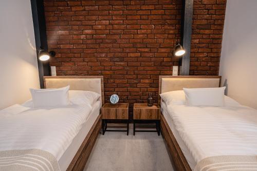 Postel nebo postele na pokoji v ubytování Garni Hotel DOCK Bratislava