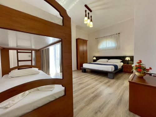 Postel nebo postele na pokoji v ubytování Hotel Benilva