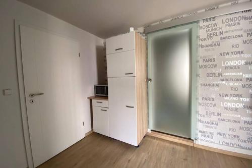 an empty room with a closet and a sliding door at Das alte Zollhäuschen in Bad Laasphe