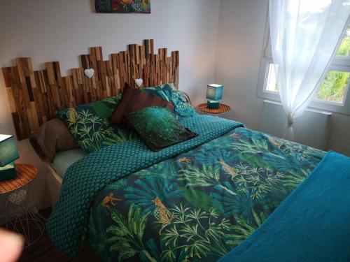 En eller flere senge i et værelse på La Maison D'ayona