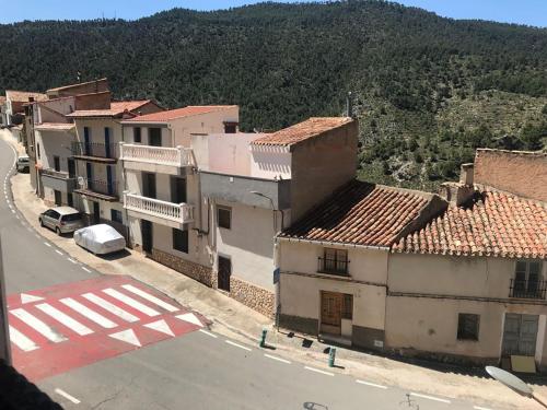 an aerial view of a town with buildings and a street at Alojamientos Rurales Entre Rocas in Ayna