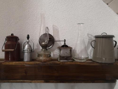 a shelf with various items on top of it at TücsökTanya Vendégház in Csemő