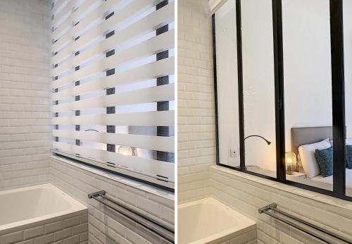 La salle de bains est pourvue d'une baignoire et d'une fenêtre. dans l'établissement Nestor&Jeeves - REINE MARIE TERRASSE - Central - Very close sea - Top floor, à Nice