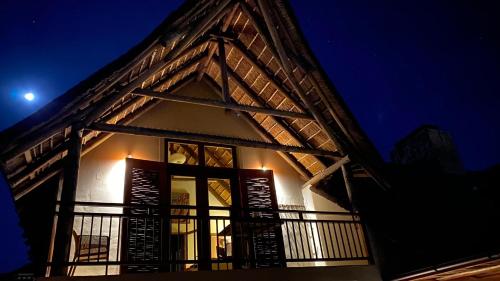 a building with a balcony at night at 43 On Sandstone in Somerset West