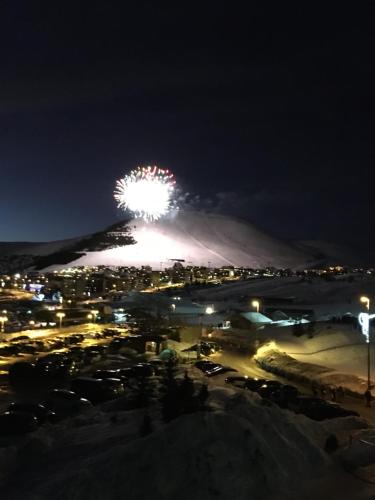 a firework display on top of a mountain at night at Appartement dans Residence 4* les Bergers- Alpe d'Huez in L'Alpe-d'Huez