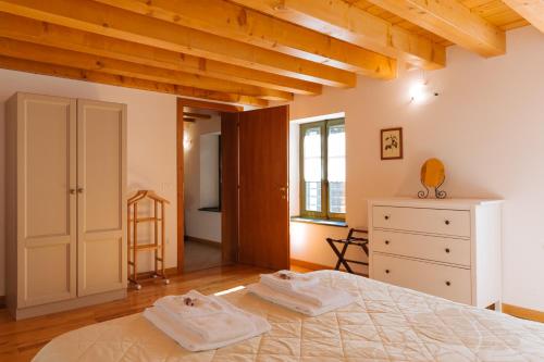 Ліжко або ліжка в номері Albergo Diffuso Polcenigo P.Lacchin
