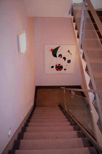 a staircase with a painting on the wall at Park Hotel Sporting in Teramo