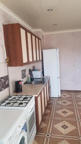 Dapur atau dapur kecil di Cozy Apartment on Rimgorskaia 6
