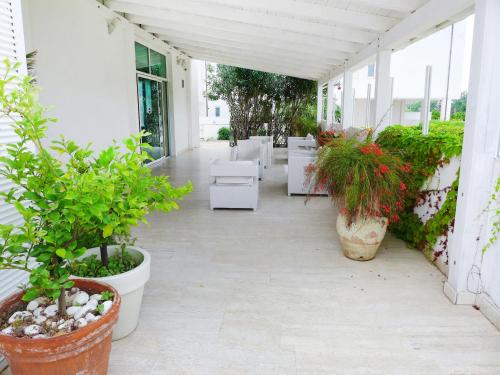 a patio with potted plants on a building at Apartment Stella Marina by Interhome in San Salvo