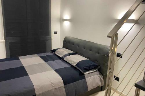Postel nebo postele na pokoji v ubytování ATTICO Milano-Bicocca