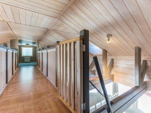 a hallway of a house with wooden ceilings at Holiday Home Rukan taikavuosseli 12 a by Interhome in Ruka