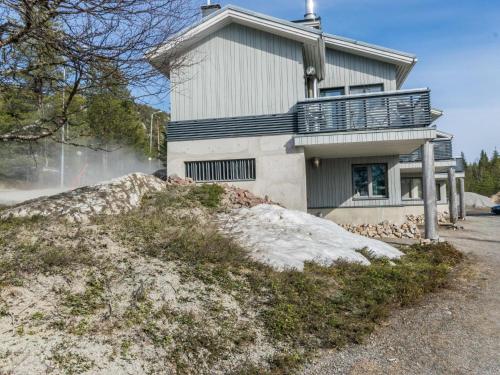 a house on top of a pile of snow at Holiday Home Palokärki by Interhome in Ruka