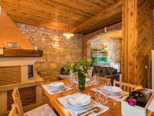 a dining room with a table with plates and glasses at Holiday Home Vera by Interhome in Sveti Ivan