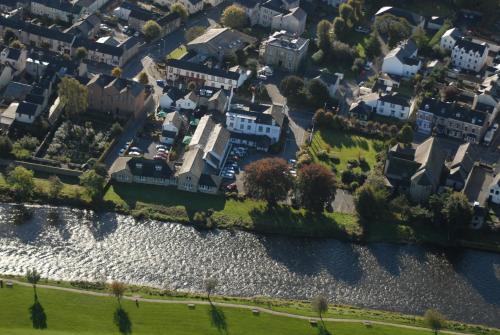 an aerial view of a city with houses and a river at Trout Hotel in Cockermouth