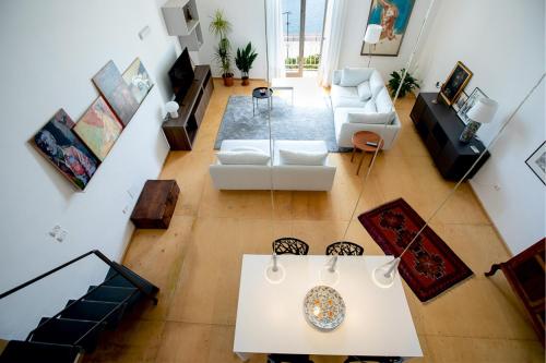an aerial view of a living room with a table at Seaview Design Homes in Ortigia by Wonderful Italy in Siracusa