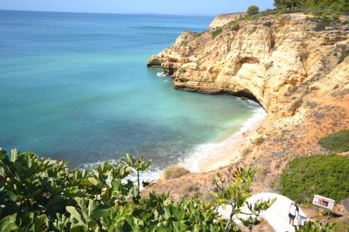 a view of a beach from a cliff at T0 Junto a Praia de Vale Centeanes / Carvoeiro in Lagoa
