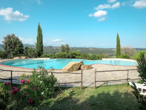 a swimming pool in a yard with a fence at Holiday Home Ginestre 9 by Interhome in Santo