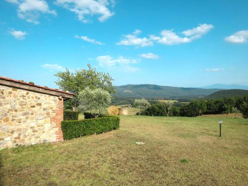 a view from the backyard of a house with mountains in the background at Holiday Home Ginestre 9 by Interhome in Santo