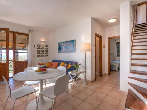 a living room with a white table and chairs at Holiday Home Querceto by Interhome in Sassofortino