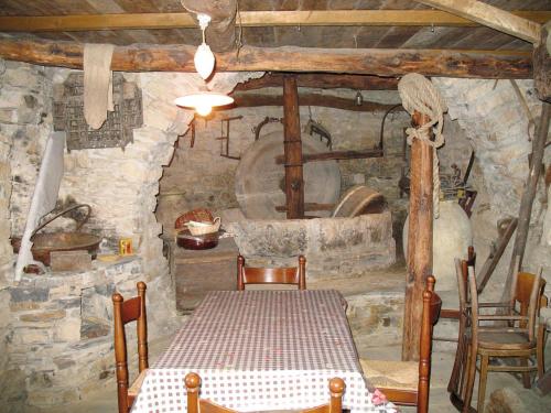 a kitchen with a table and chairs in a room at Holiday Home I Ciasi - VSP200 by Interhome in Ville San Sebastiano