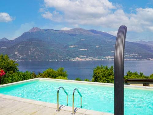 a swimming pool with a view of the mountains at Apartment Glicine by Interhome in Perledo