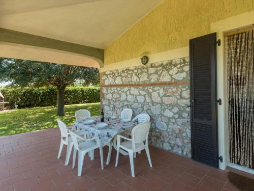 a table and chairs sitting on a patio at Holiday Home Podere Chiocciolaia by Interhome in Podere Cernaia