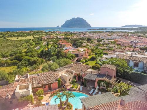 an aerial view of a villa with a swimming pool at Holiday Home Corbezzolo 9 - Vista Village by Interhome in Porto San Paolo