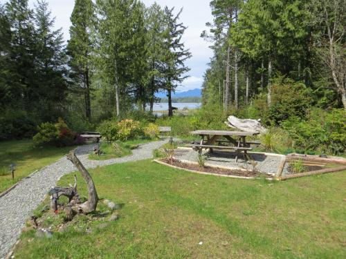 a picnic table in the grass in a park at C&N Backpackers - Ucluelet in Ucluelet
