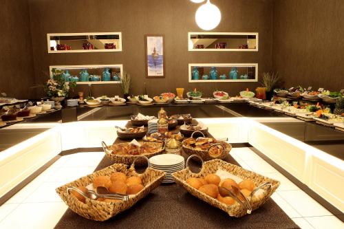 a buffet line with baskets of food on a table at Grand Hotel Gulsoy Old City in Istanbul