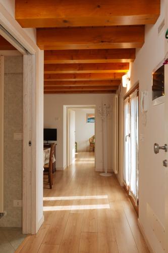 a hallway in a house with wooden ceilings at Albergo Diffuso Polcenigo C. Zoldan in Polcenigo