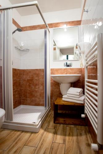 a bathroom with a shower and a sink at Trapani Home in Trapani