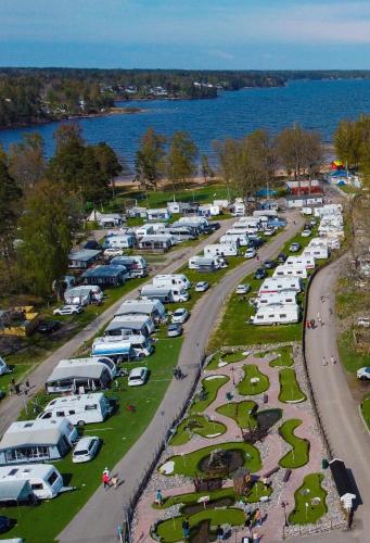 an aerial view of a parking lot with parked cars at Ursand Resort & Camping in Vänersborg