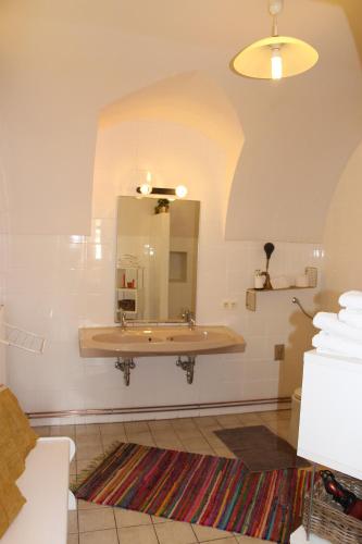 a bathroom with a sink and a mirror at Gästehaus Kleine Mühle in Krems an der Donau